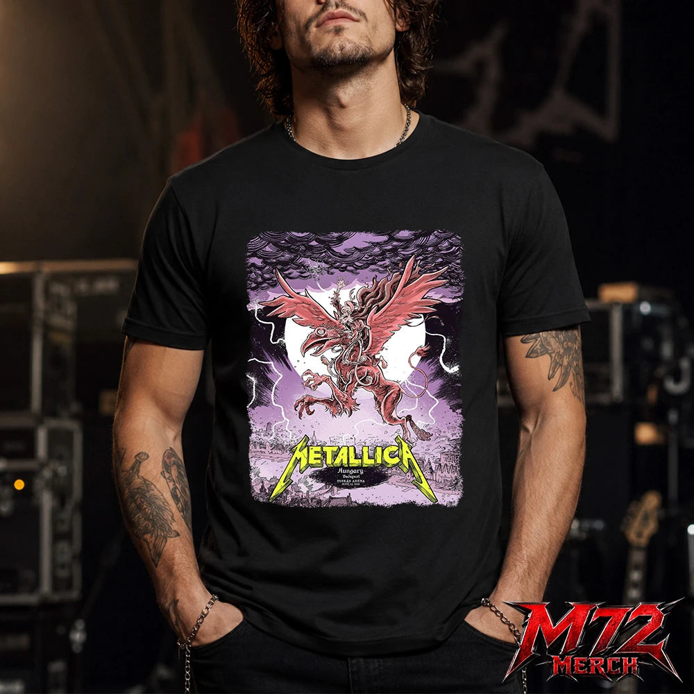 Metallica M72 World Tour June 13 2026 Budapest Hungary Puskás Aréna T-Shirt featuring winged beast, red wings, storm clouds, lightning, full moon, gothic city scenery, and heavy metal artwork