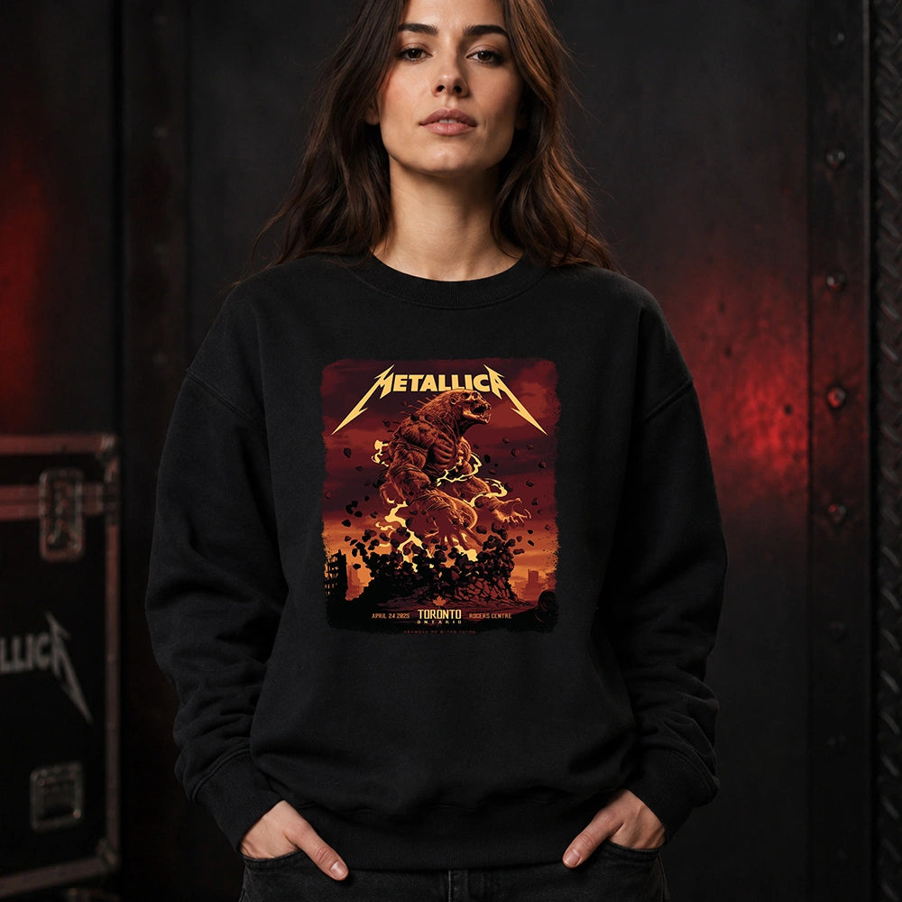 Metallica M72 World Tour April 24 2025 Rogers Centre Toronto Ontario Canada T-shirt by John Guydo featuring a roaring beast rising from shattered rubble with flying debris, fiery red-orange sky and Toronto event text.