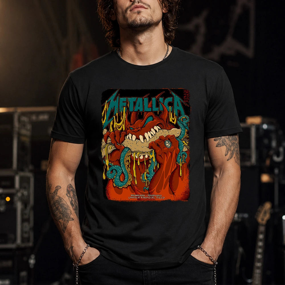Metallica M72 World Tour May 25 2025 Lincoln Financial Field Philadelphia Pennsylvania United States T-shirt by Squindo featuring a monstrous fanged creature with red hands, blue-green tentacles, dripping yellow slime and Philadelphia event text.
